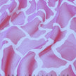 Pink giraffe-printed mulberry silk chiffon fabric with a sheer, flowing hand by JB Silks.